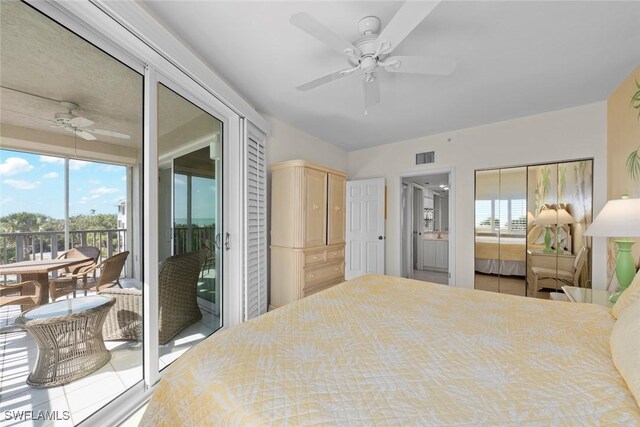 bedroom with access to exterior, visible vents, and a ceiling fan