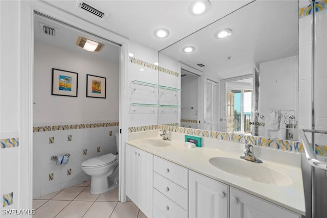 full bath featuring visible vents, a sink, toilet, and tile patterned floors