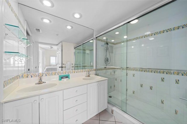 bathroom with a stall shower, visible vents, a sink, and ensuite bath