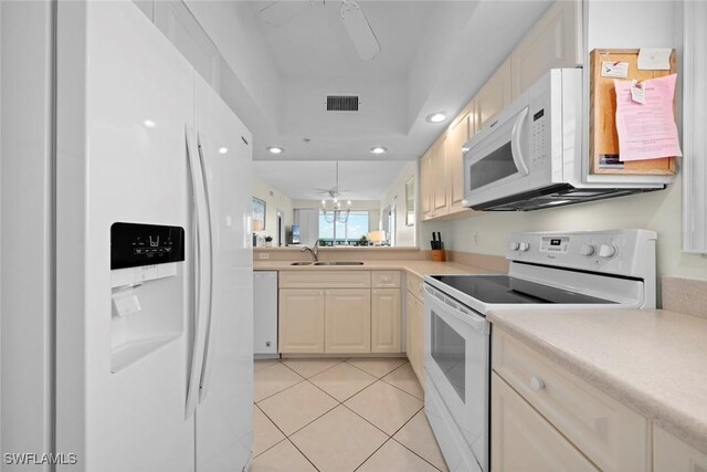 kitchen featuring white appliances, light tile patterned floors, visible vents, ceiling fan, and a sink