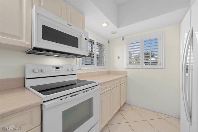 kitchen with white appliances, light tile patterned floors, baseboards, light countertops, and recessed lighting