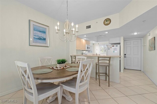 dining space with light tile patterned floors, visible vents, a chandelier, and recessed lighting