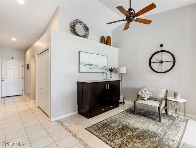 living area with light tile patterned floors, ceiling fan, baseboards, and recessed lighting