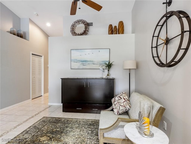 sitting room featuring recessed lighting, tile patterned flooring, a ceiling fan, and baseboards