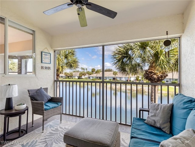 sunroom / solarium with a water view