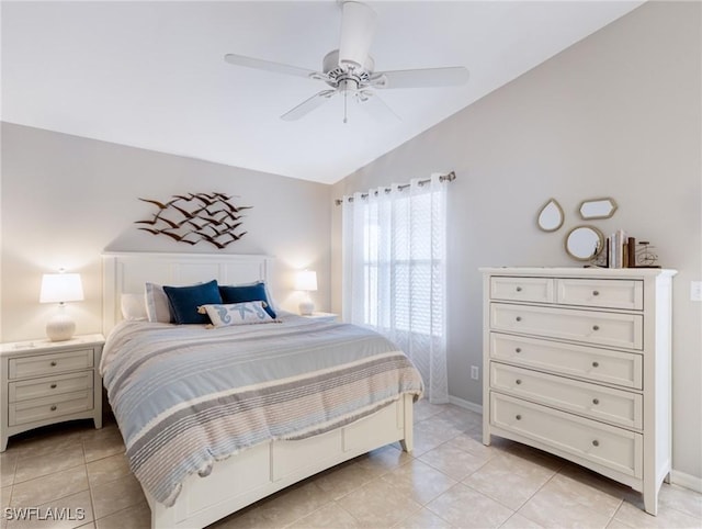 bedroom featuring lofted ceiling, light tile patterned floors, ceiling fan, and baseboards