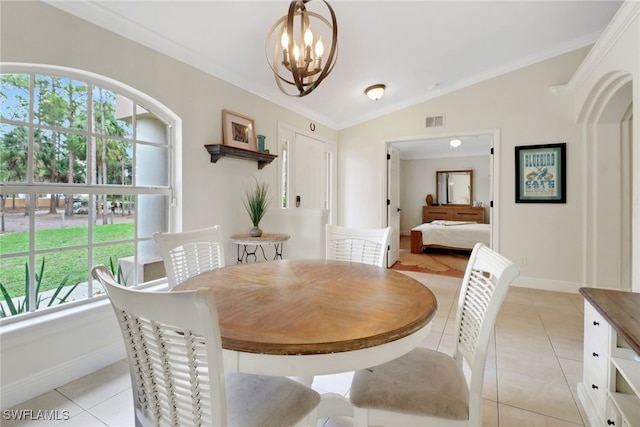 dining space featuring ornamental molding, lofted ceiling, visible vents, and light tile patterned flooring