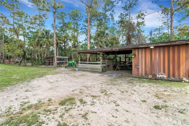 exterior space featuring an outbuilding and an exterior structure