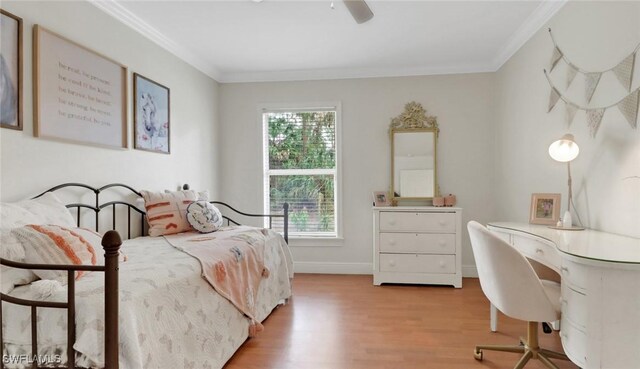 bedroom with ornamental molding, ceiling fan, light wood-style flooring, and baseboards