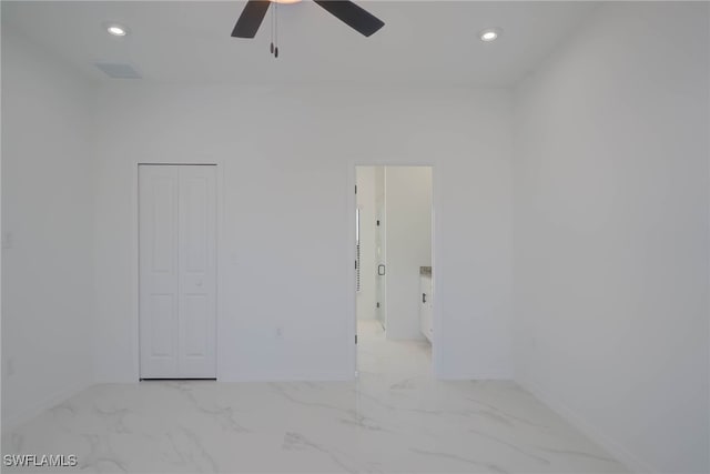 unfurnished room with ceiling fan, marble finish floor, and recessed lighting