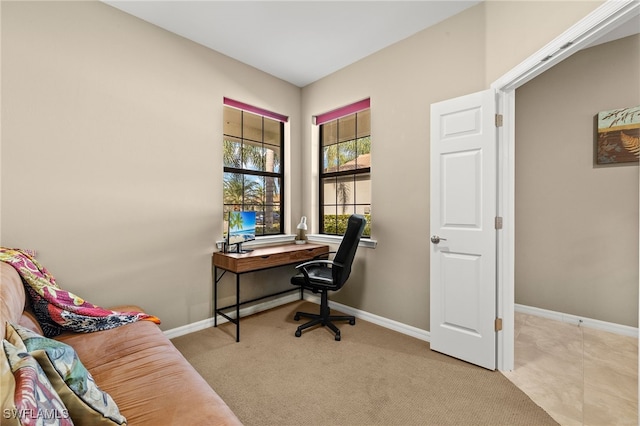 office space with light carpet and baseboards