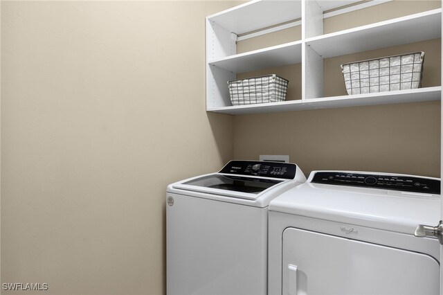 washroom with laundry area and separate washer and dryer