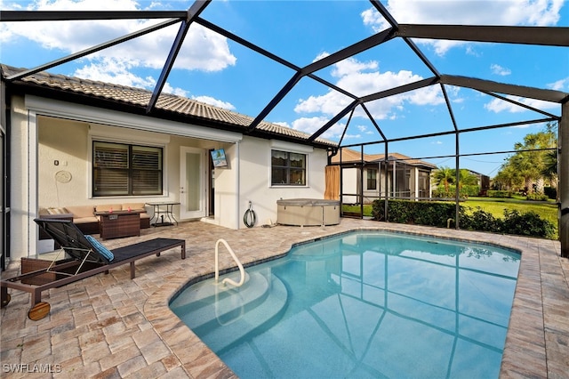 outdoor pool featuring a lanai, a jacuzzi, and a patio