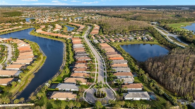 bird's eye view featuring a residential view and a water view