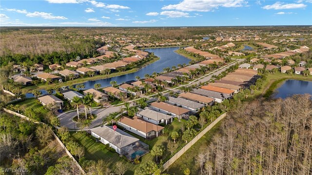 aerial view with a water view and a residential view