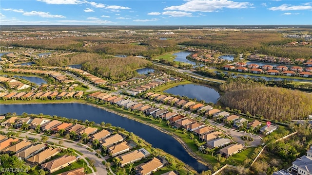 birds eye view of property featuring a water view and a residential view