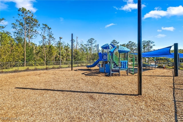 communal playground featuring fence