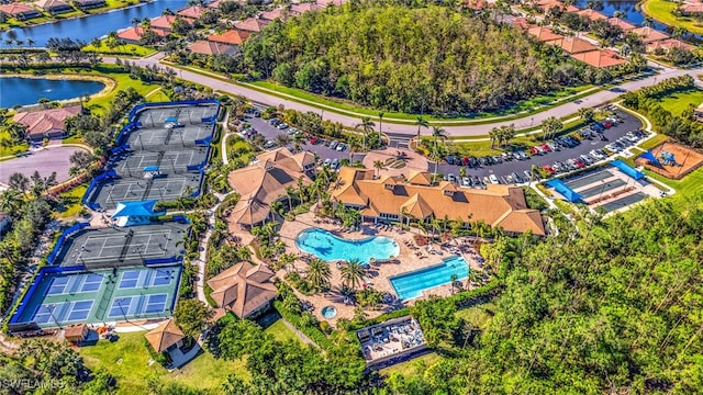 bird's eye view featuring a water view and a residential view