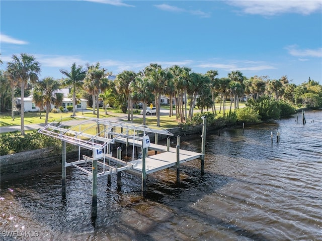 dock area with a water view and boat lift