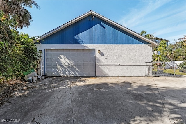 garage featuring fence