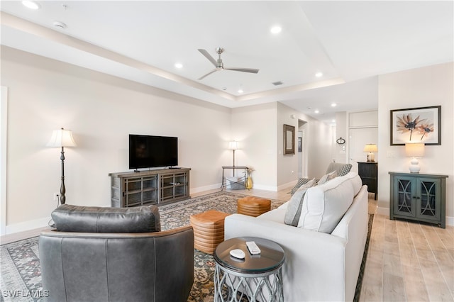 living area featuring baseboards, recessed lighting, visible vents, and light wood-style floors