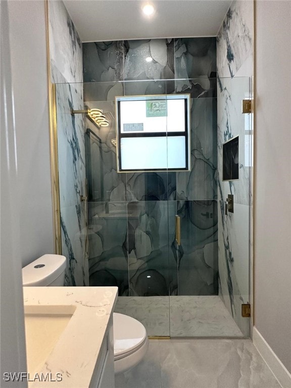 bathroom featuring a marble finish shower, marble finish floor, toilet, and vanity