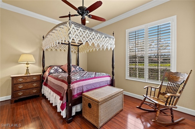 bedroom with baseboards, wood finished floors, and crown molding