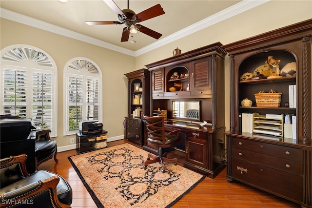 home office with baseboards, ceiling fan, ornamental molding, and wood finished floors