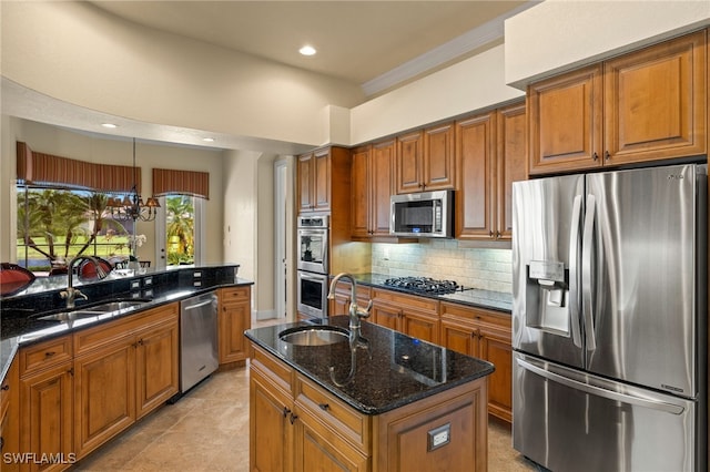 kitchen featuring stainless steel appliances, brown cabinetry, and a sink