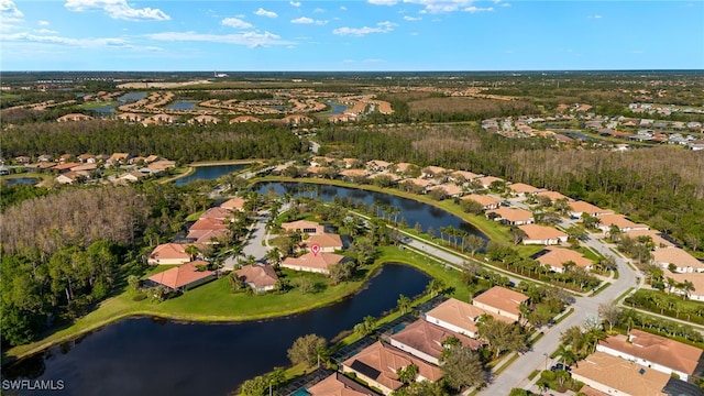 drone / aerial view with a water view and a residential view