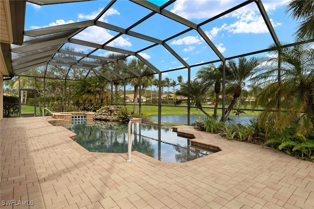 outdoor pool featuring a water view, a patio area, a jacuzzi, and a lanai