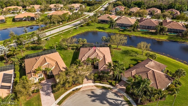 aerial view featuring a water view and a residential view