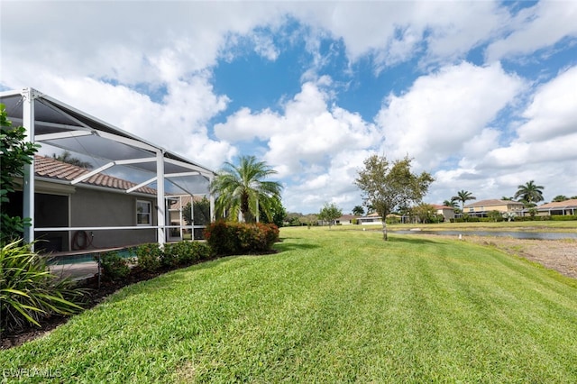 14783 Cranberry Ct, Naples, FL 34114 - view of green lawn featuring a water view and a lanai