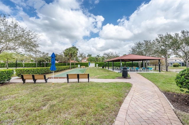 view of property's community featuring a gazebo and a lawn