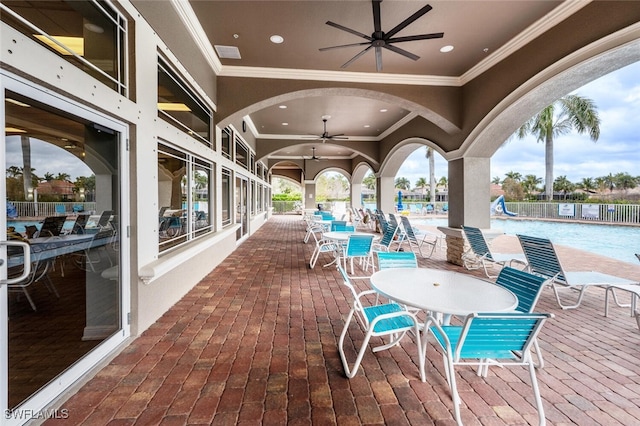 view of patio / terrace with visible vents, ceiling fan, and a community pool