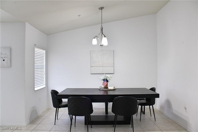 dining area with light tile patterned floors, an inviting chandelier, and baseboards