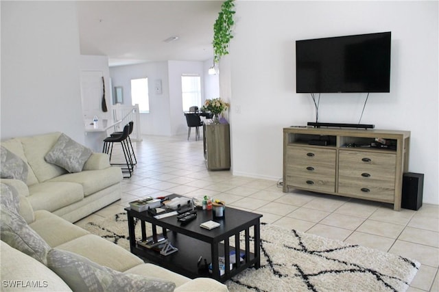 living room featuring light tile patterned flooring