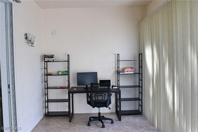 tiled office space with a textured wall