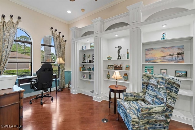 home office with dark wood-type flooring, baseboards, crown molding, and built in shelves