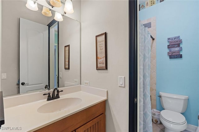 bathroom with toilet and vanity