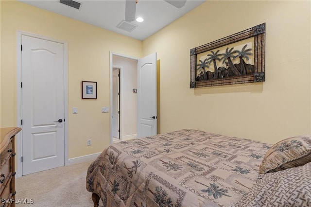 carpeted bedroom with a ceiling fan, visible vents, and baseboards