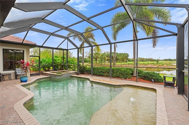 view of pool with a water view, glass enclosure, a pool with connected hot tub, and a patio