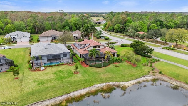 bird's eye view featuring a water view and a view of trees