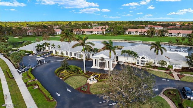 drone / aerial view featuring a residential view and a water view