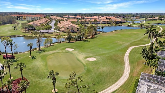 bird's eye view featuring a water view, a residential view, and golf course view