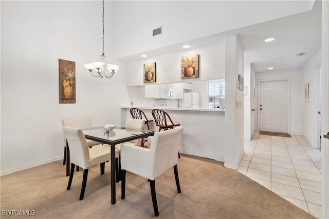 dining area featuring recessed lighting, visible vents, a chandelier, and light colored carpet