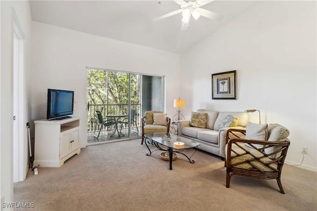 living room with vaulted ceiling, ceiling fan, and light colored carpet