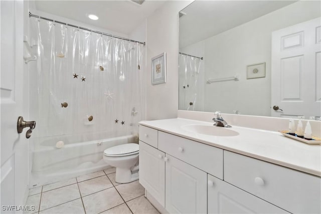 full bath with shower / tub combo, tile patterned flooring, vanity, and toilet