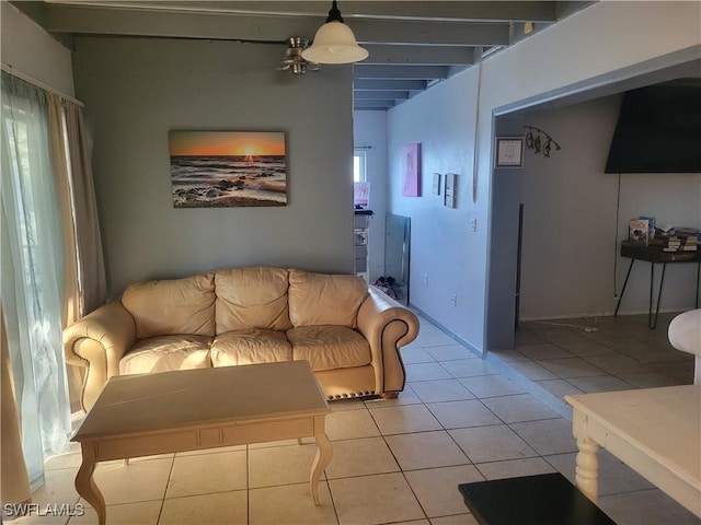 living room featuring beam ceiling, ceiling fan, and light tile patterned floors