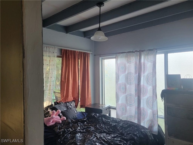 bedroom with beam ceiling